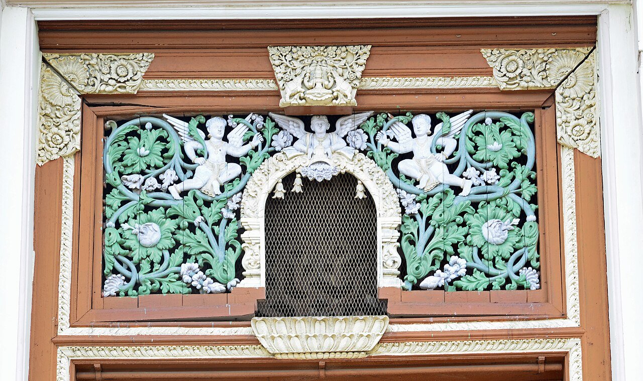 Painted and carved window detail at Jaganmohan Palace