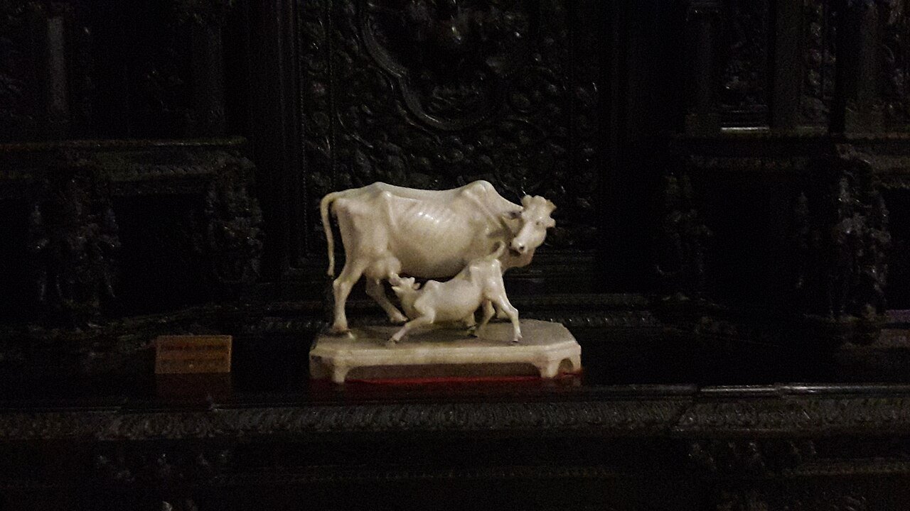 A marble cow and calf in the art collection at Jai Vilas Palace