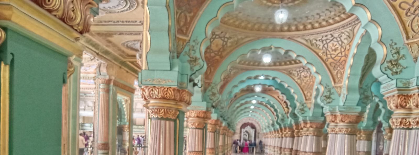 Ornate pillared hall inside Mysore Palace